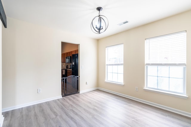 137 Salem Creek Dr, Goose Creek, SC 29445 - unfurnished room with a chandelier and light wood-style floors