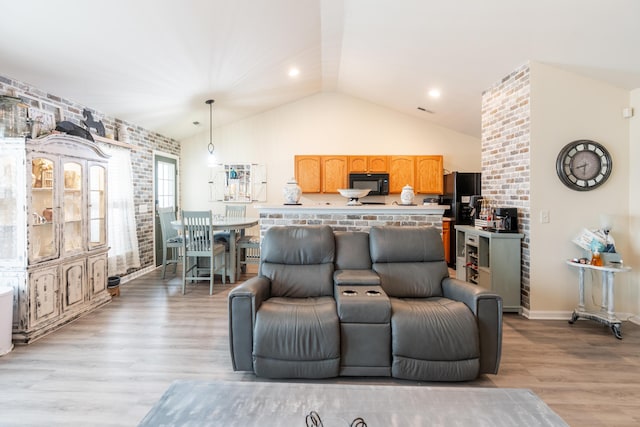 137 Salem Creek Dr, Goose Creek, SC 29445 - living area featuring vaulted ceiling, light wood-style floors, and brick wall