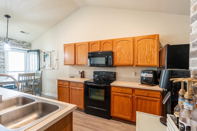 137 Salem Creek Dr, Goose Creek, SC 29445 - kitchen with black appliances, light countertops, light wood finished floors, decorative light fixtures, and high vaulted ceiling