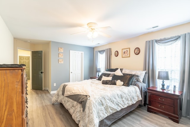 137 Salem Creek Dr, Goose Creek, SC 29445 - bedroom with light wood-style floors, a ceiling fan, and a closet