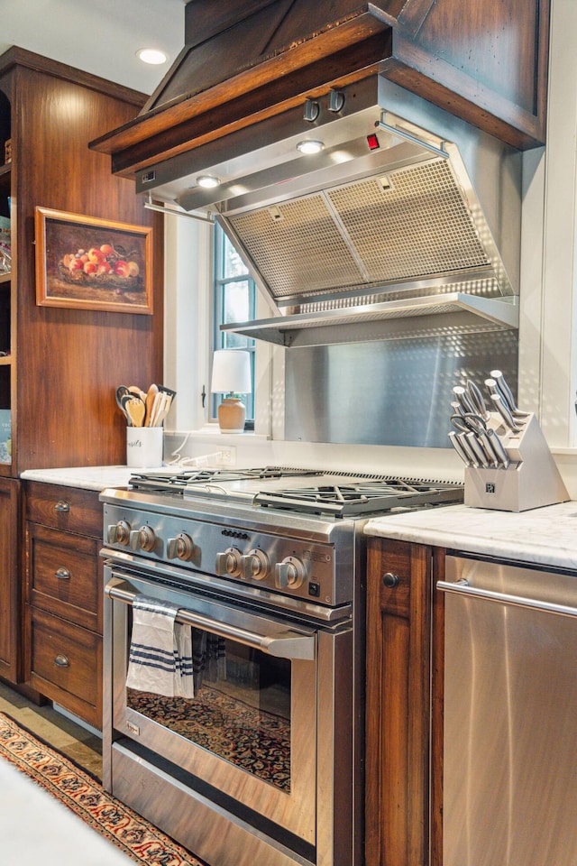 kitchen with island range hood, wooden walls, and stainless steel appliances