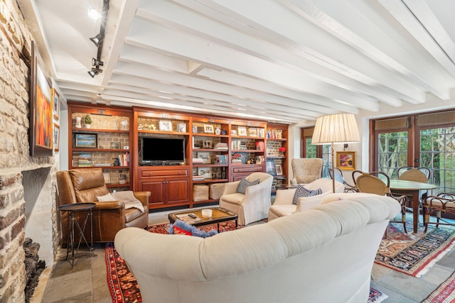 living room featuring beam ceiling