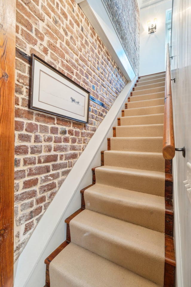 stairway with brick wall