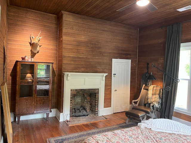 5924 Wagener Rd, Wagener, SC 29164 - living room with ceiling fan, wooden walls, hardwood / wood-style flooring, wood ceiling, and a fireplace