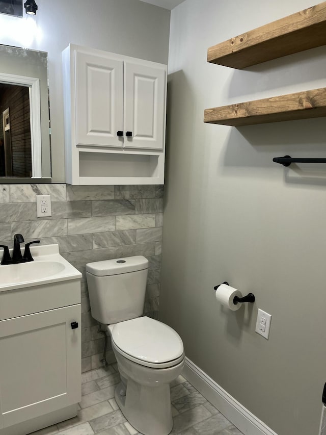 5924 Wagener Rd, Wagener, SC 29164 - half bathroom featuring toilet, vanity, marble finish flooring, and baseboards