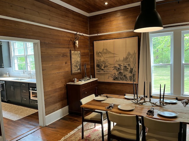 5924 Wagener Rd, Wagener, SC 29164 - dining area featuring wooden walls, dark wood-style flooring, crown molding, and wood ceiling