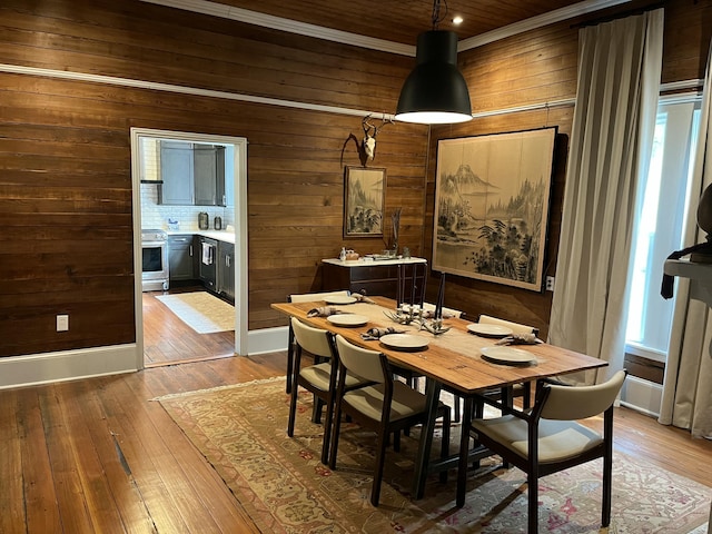 5924 Wagener Rd, Wagener, SC 29164 - dining space with wood walls, hardwood / wood-style flooring, baseboards, and wooden ceiling