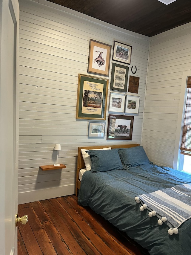 5924 Wagener Rd, Wagener, SC 29164 - bedroom with wood walls, dark wood finished floors, and wooden ceiling