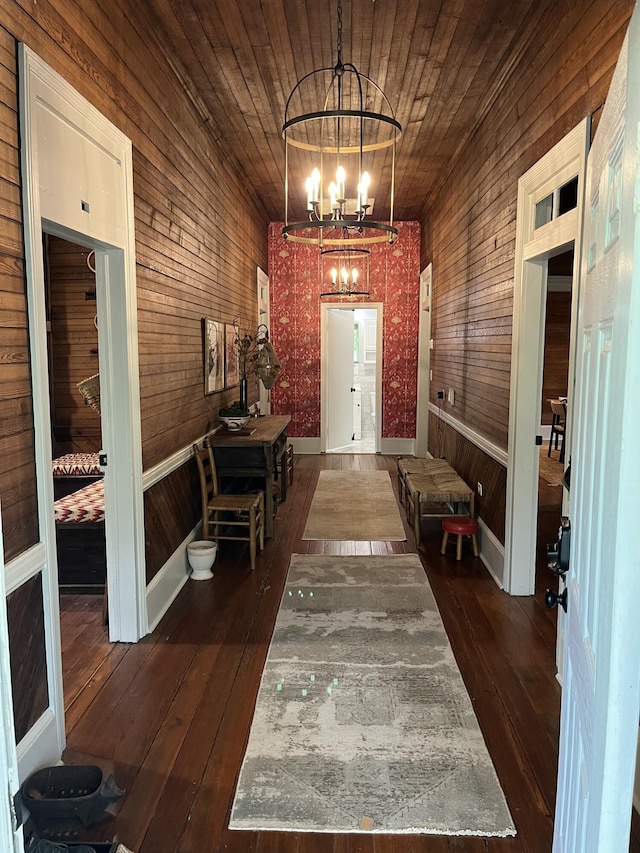 5924 Wagener Rd, Wagener, SC 29164 - entryway with a chandelier, wooden walls, and dark wood-style floors
