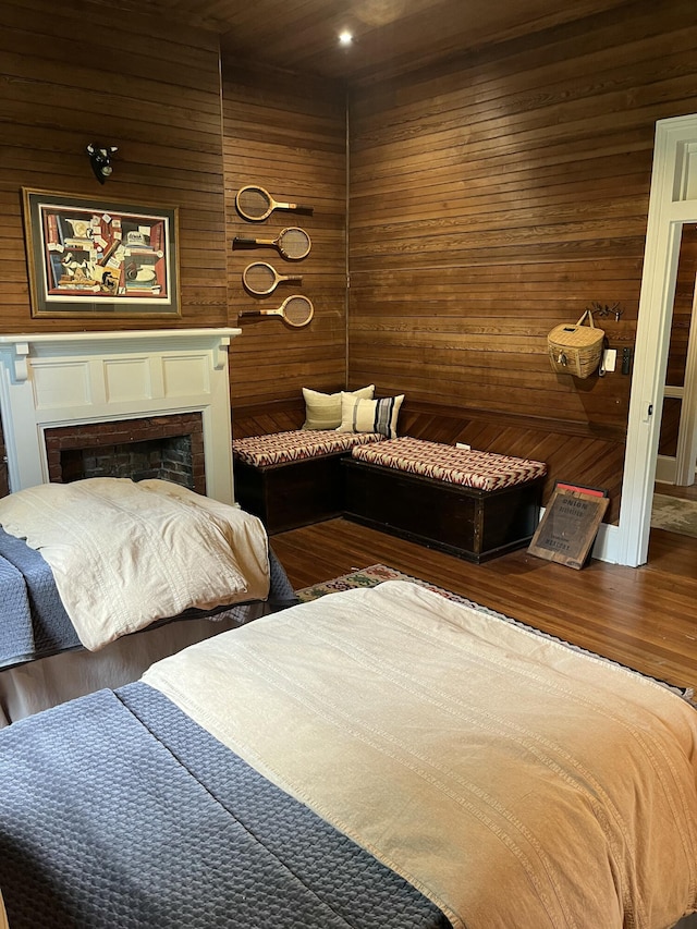 5924 Wagener Rd, Wagener, SC 29164 - bedroom with wooden walls, a fireplace, and wood finished floors