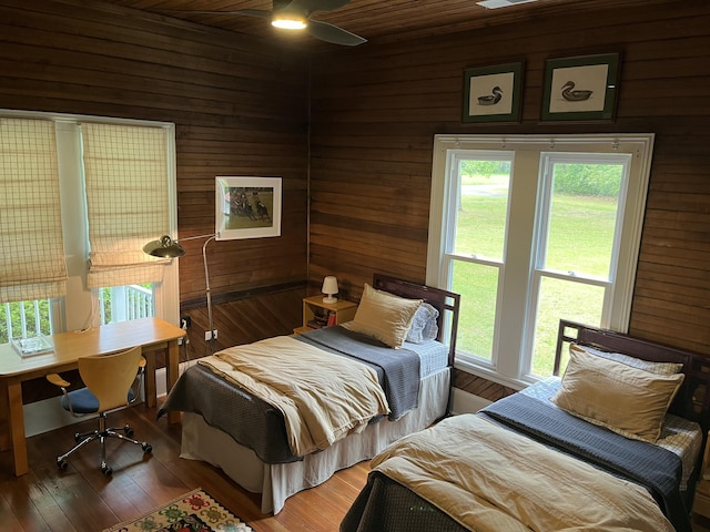 5924 Wagener Rd, Wagener, SC 29164 - bedroom featuring wood walls, an office area, and wood finished floors