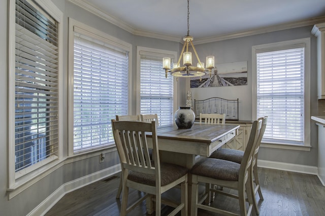 dining space with ornamental molding, a wealth of natural light, dark wood finished floors, and an inviting chandelier