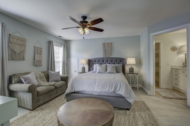 bedroom featuring light carpet, ceiling fan, and baseboards