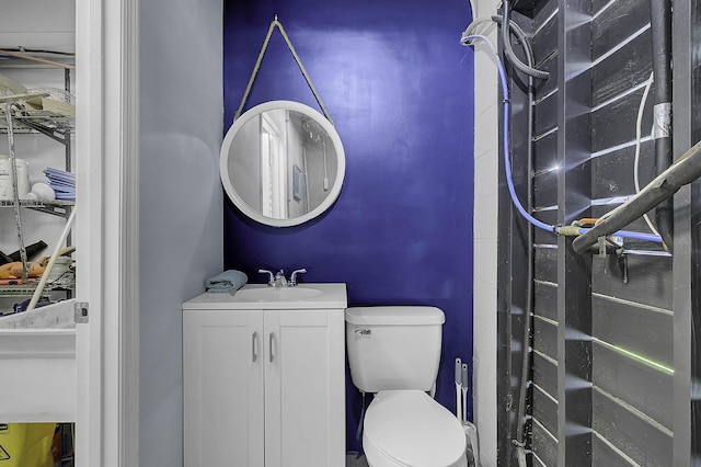 bathroom with toilet and vanity