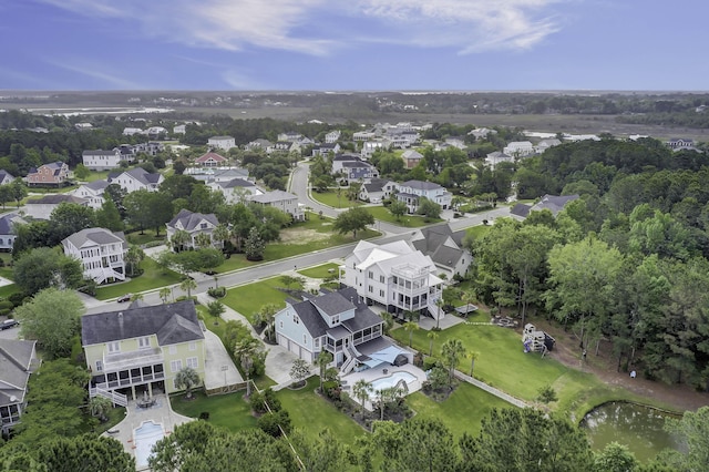 birds eye view of property with a water view and a residential view