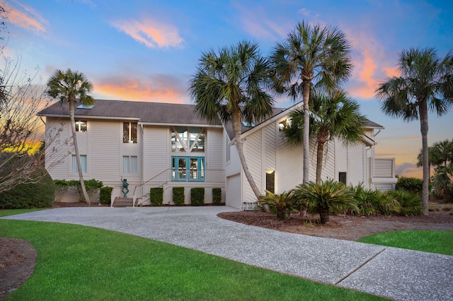 view of front of property featuring driveway and an attached garage