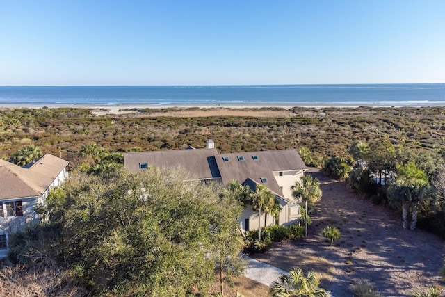 drone / aerial view featuring a water view and a view of the beach