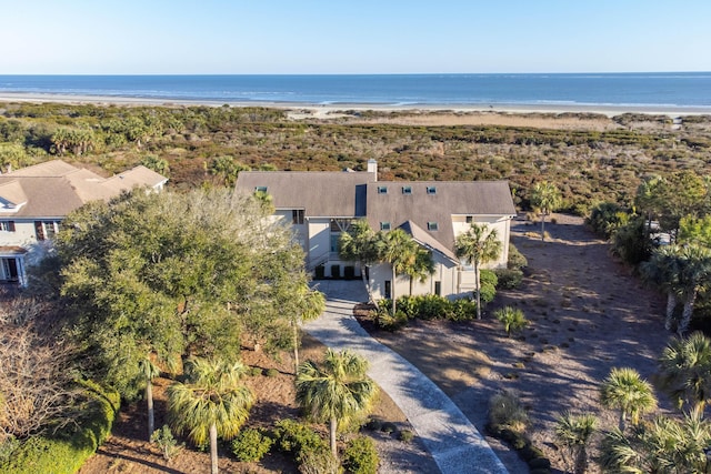 drone / aerial view featuring a view of the beach and a water view