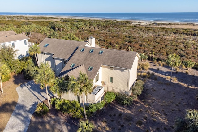 bird's eye view with a water view and a beach view