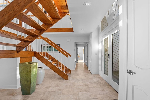 interior space with baseboards and recessed lighting