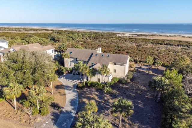 drone / aerial view featuring a beach view and a water view