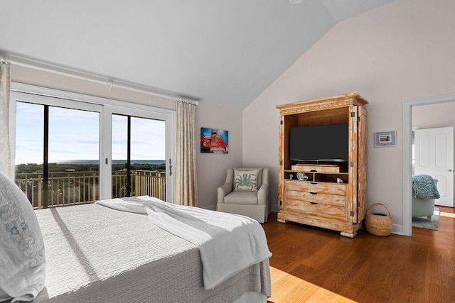 bedroom featuring access to outside, lofted ceiling, baseboards, and wood finished floors