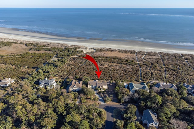 bird's eye view featuring a water view and a view of the beach