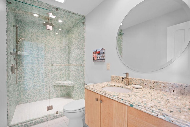 full bath featuring toilet, a stall shower, tile patterned flooring, and vanity