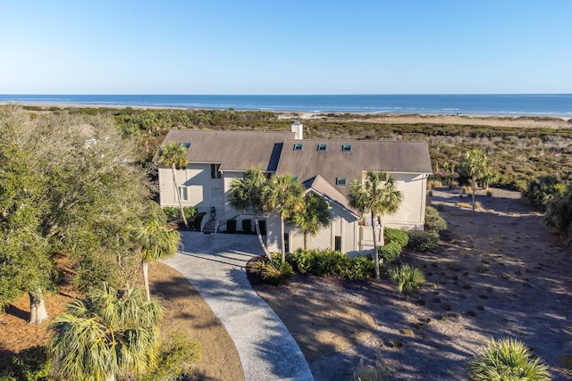 drone / aerial view featuring a view of the beach and a water view