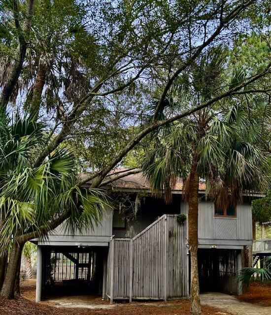 view of side of home featuring a carport