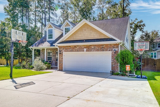 view of front of property featuring a garage and a front yard