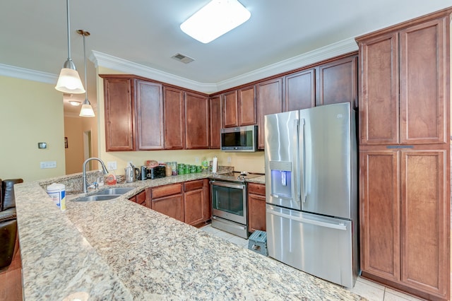 kitchen featuring appliances with stainless steel finishes, light tile patterned flooring, pendant lighting, ornamental molding, and sink