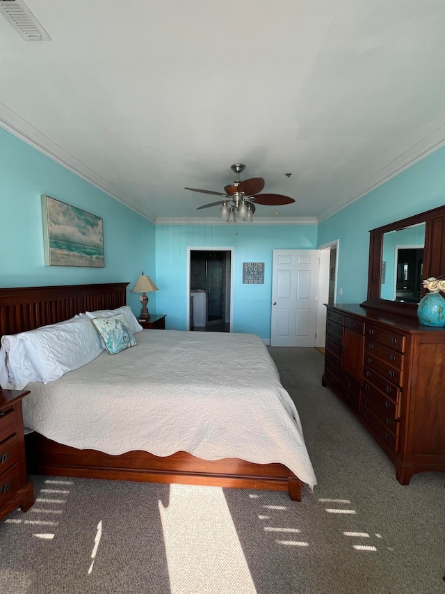 carpeted bedroom featuring crown molding and ceiling fan