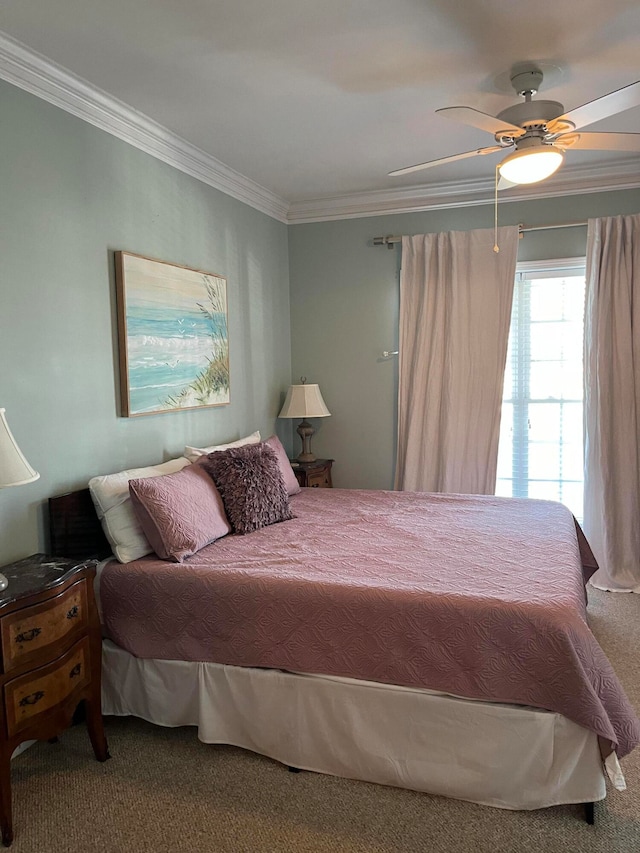 bedroom featuring ornamental molding, carpet, and ceiling fan