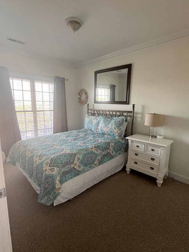 carpeted bedroom with crown molding