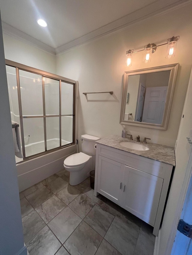 full bathroom featuring vanity, toilet, crown molding, and bath / shower combo with glass door