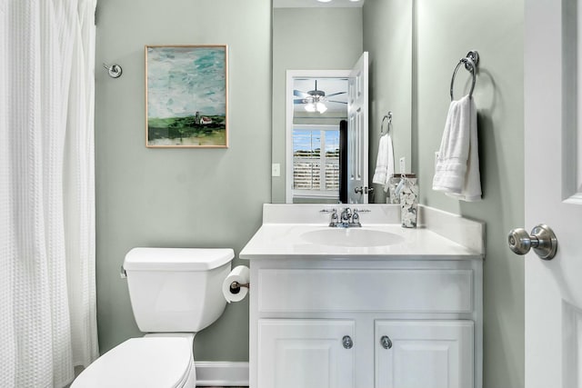 bathroom featuring ceiling fan, vanity, and toilet