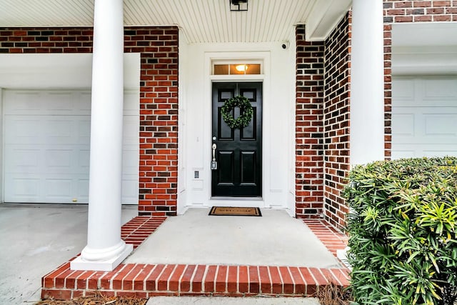 doorway to property featuring a garage