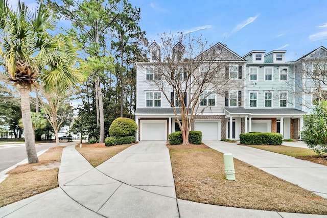 townhome / multi-family property featuring a garage