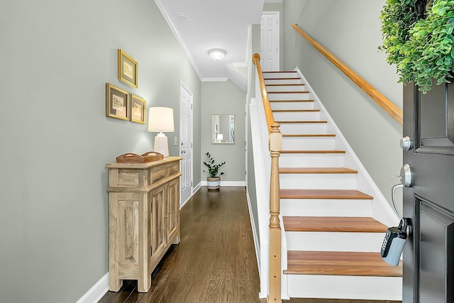 staircase featuring hardwood / wood-style flooring and crown molding