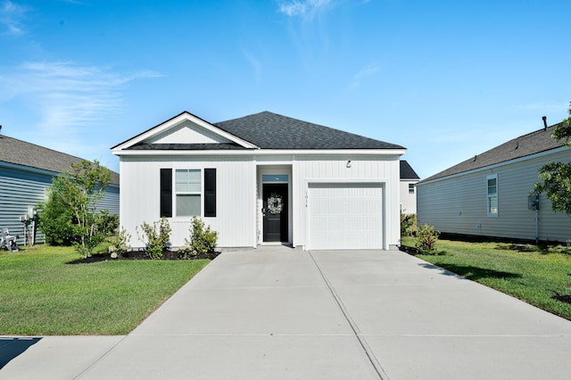 1014 Peridote Way, Ladson, SC 29456 - view of front facade with an attached garage, concrete driveway, a front lawn, and roof with shingles