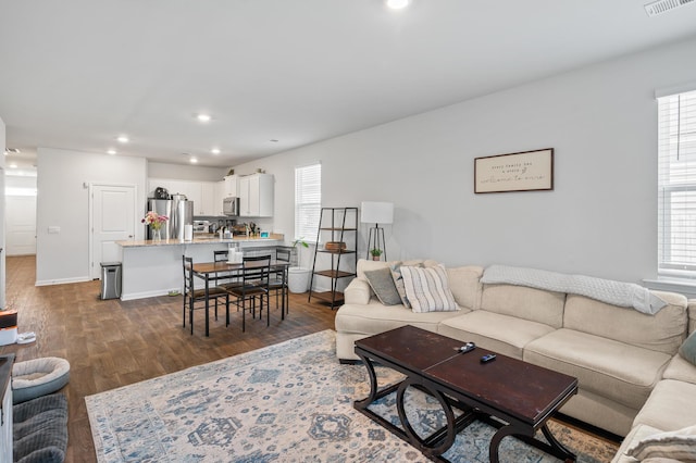 1014 Peridote Way, Ladson, SC 29456 - living room with healthy amount of natural light, dark wood finished floors, recessed lighting, and baseboards