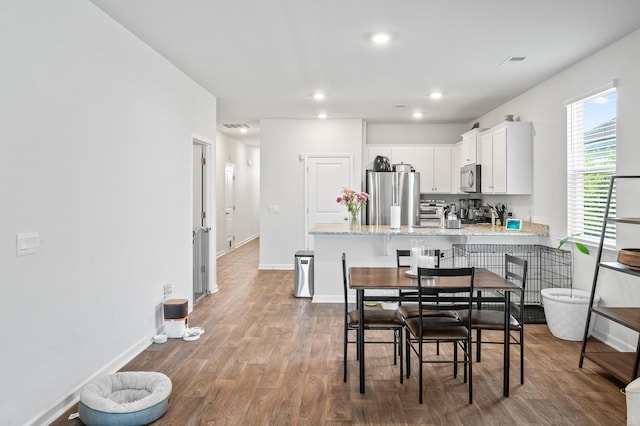 1014 Peridote Way, Ladson, SC 29456 - dining area featuring wood finished floors, recessed lighting, and baseboards