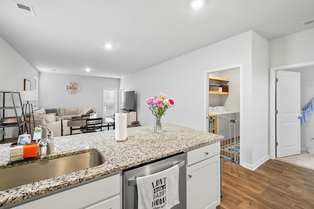 1014 Peridote Way, Ladson, SC 29456 - kitchen featuring stainless steel dishwasher, independent washer and dryer, a sink, dark wood-style flooring, and white cabinetry