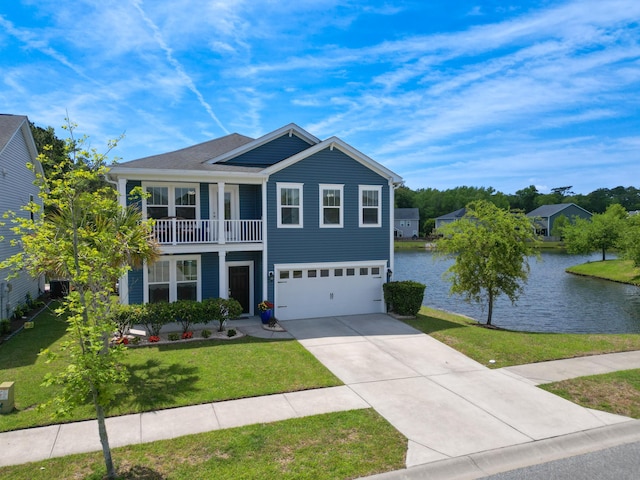 traditional home with a front yard, a water view, a garage, concrete driveway, and a balcony