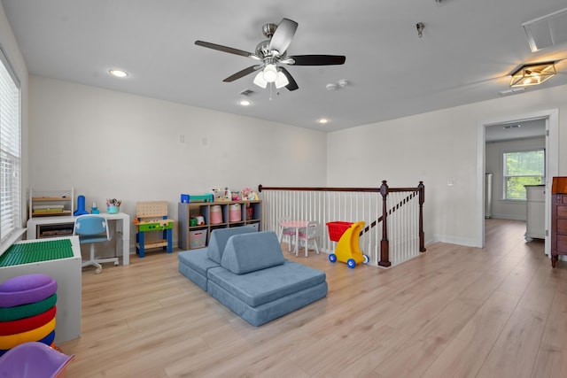 recreation room featuring wood finished floors, ceiling fan, visible vents, and recessed lighting