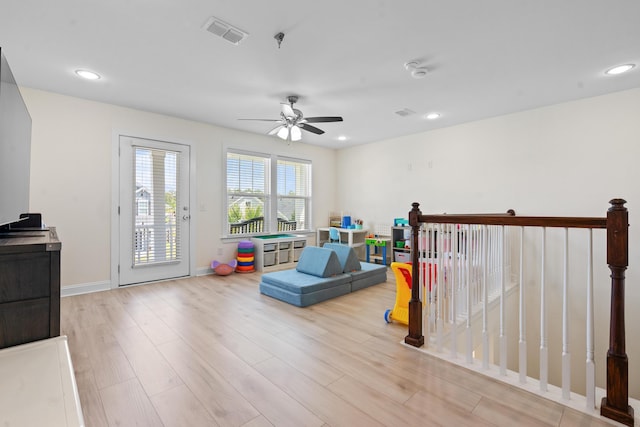 playroom with visible vents, baseboards, ceiling fan, light wood finished floors, and recessed lighting