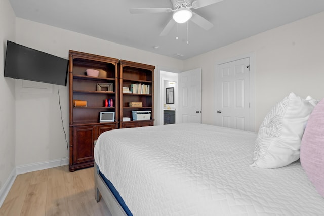bedroom with baseboards, light wood-type flooring, and a ceiling fan