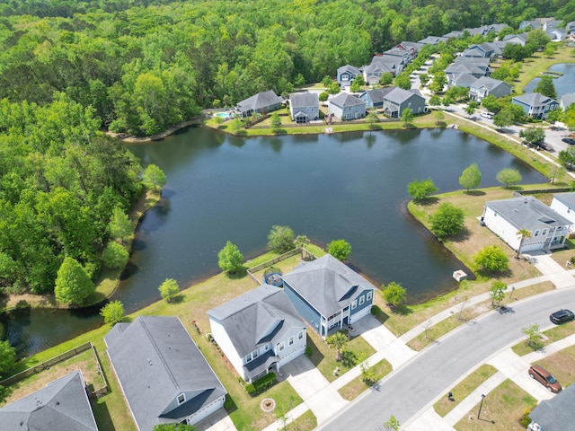 aerial view featuring a water view, a residential view, and a forest view