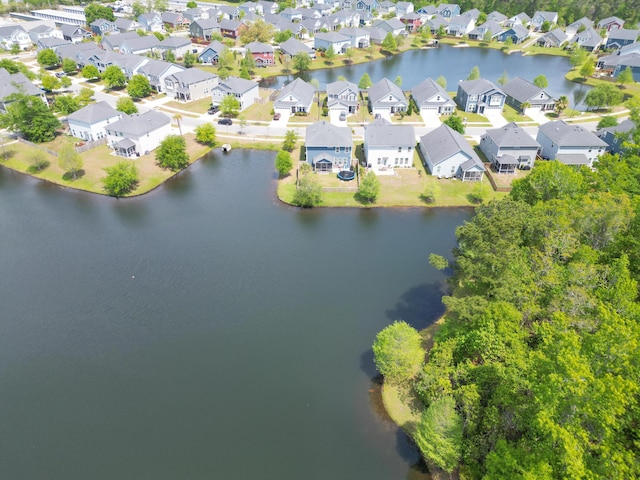 bird's eye view featuring a residential view and a water view